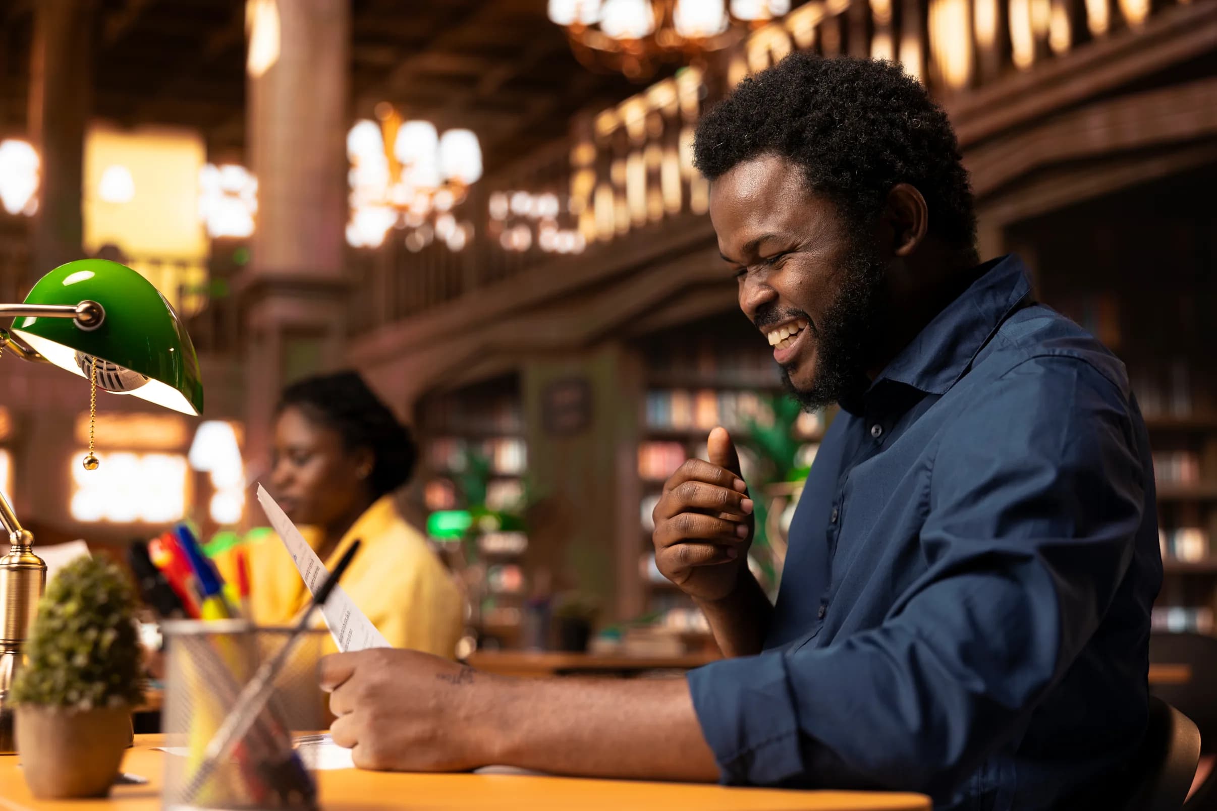 Business owner smiling while completing paperwork